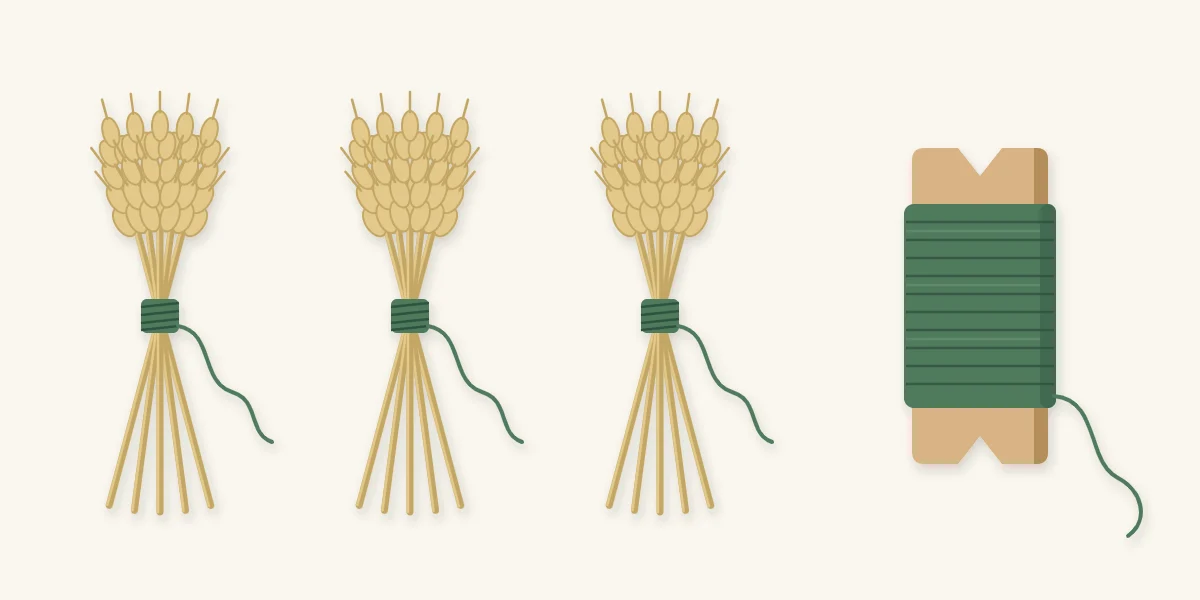 Three small wheat bundles bound with thin wire, each with a wire tail
