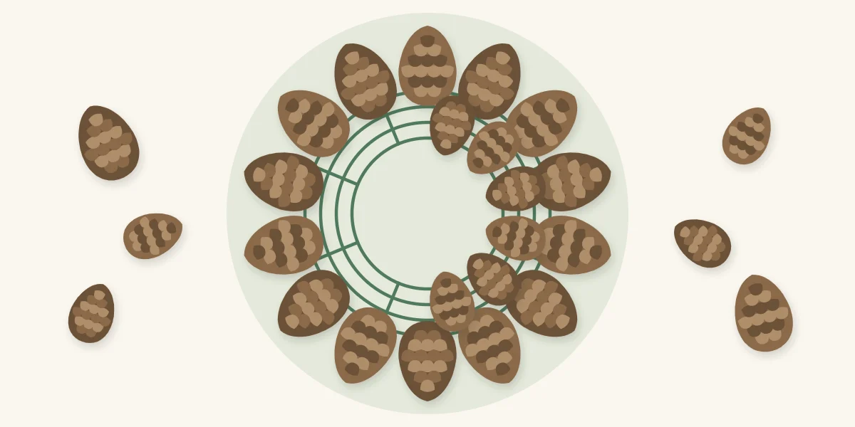 Wire frame with an outer round of cones pointing out and an inner round half complete